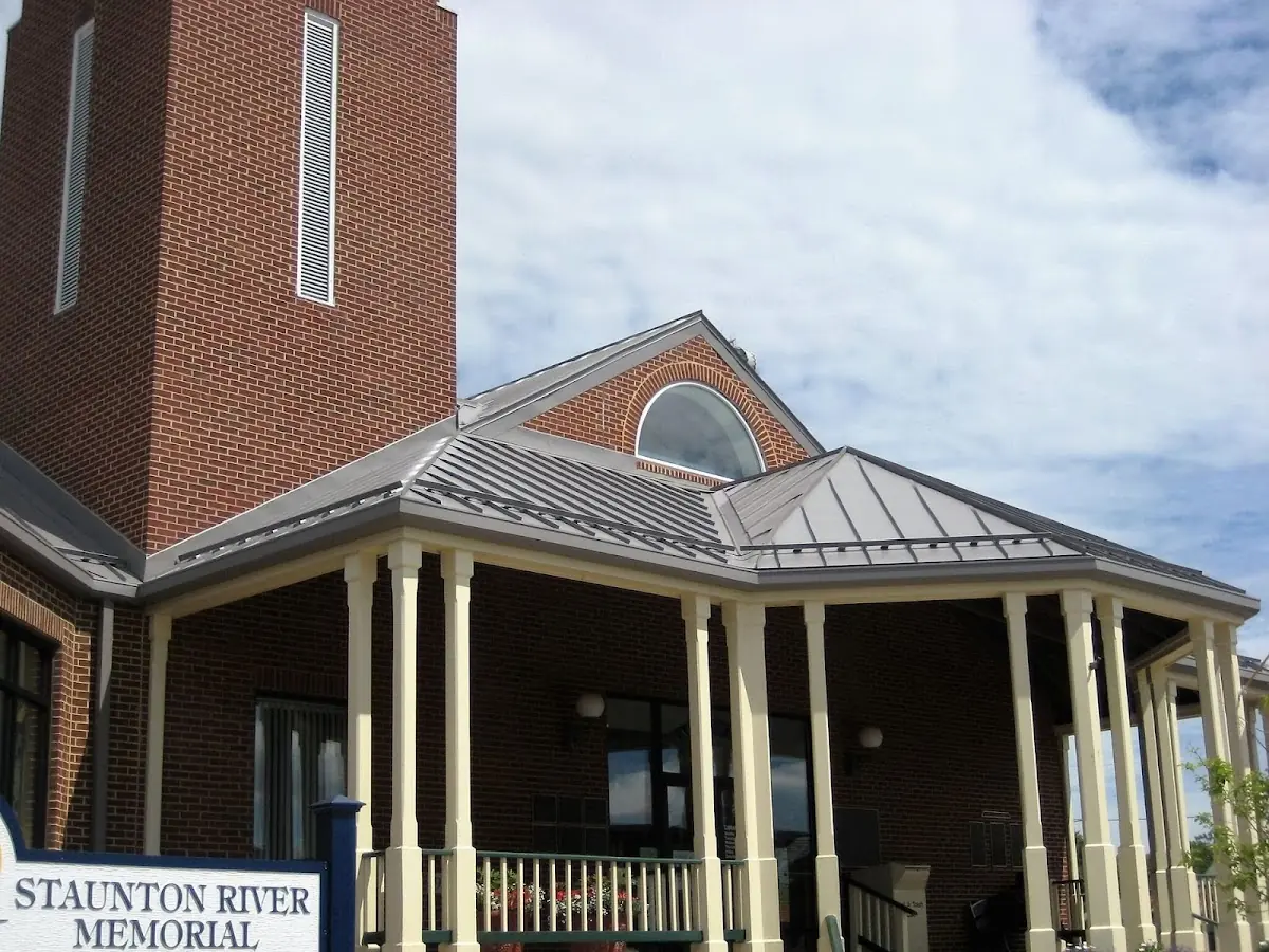 Skilled roofing craftsmen working on a residential roof in Bayonne